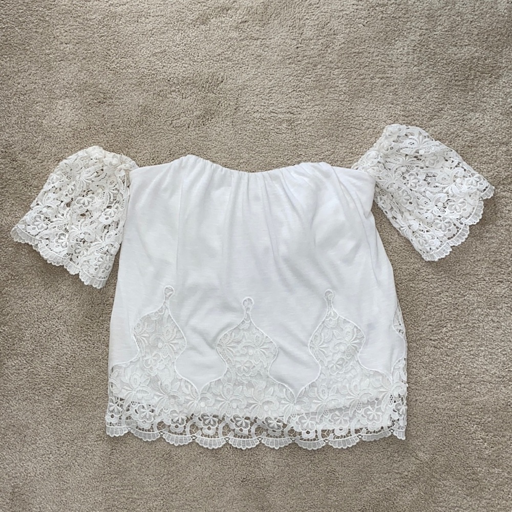 Off the shoulder lace shirt.